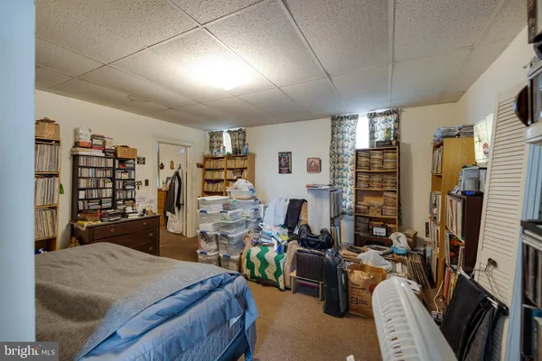 a view of a livingroom with furniture and a workspace