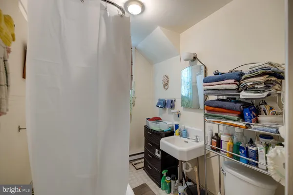 a view of a porch with wooden floor and fence