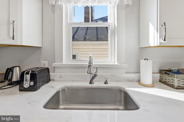 a kitchen with a sink and cabinets