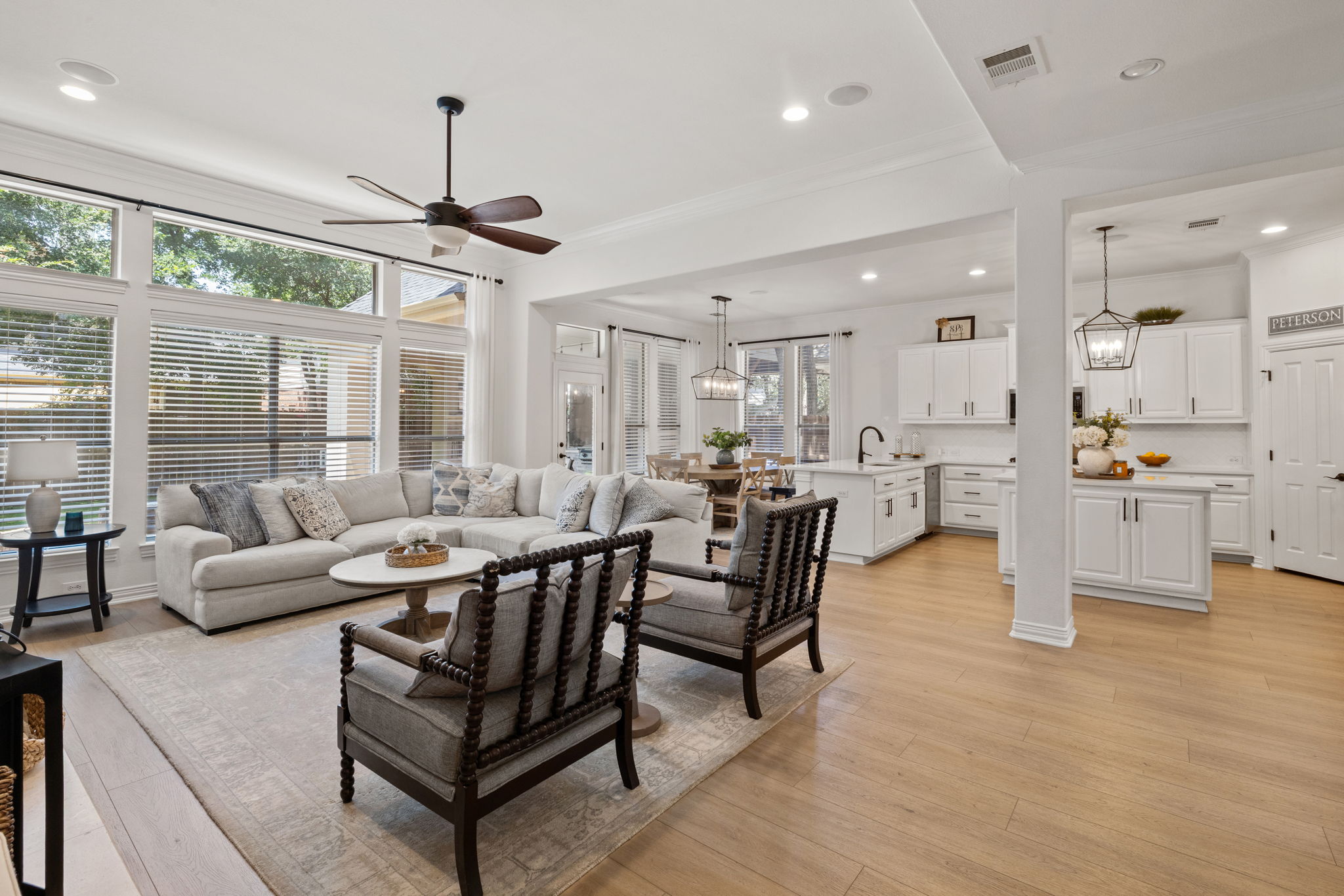1124 Castle Path Round Rock, TX 78681 - Photo 11 of 40 Natural light floods this inviting living space, connecting seamlessly with a chef-ready kitchen.