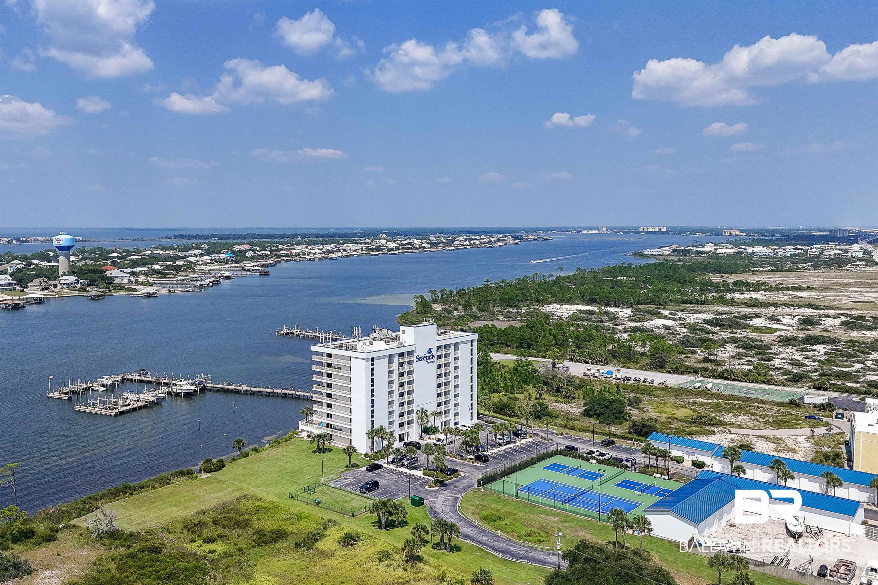 16287 Perdido Key Drive, Unit 105 Pensacola, FL 32507 - Photo 58 of 66 Coastal condominium complex featuring multiple stories, waterfront access with private docks, multiple tennis courts, and ample parking