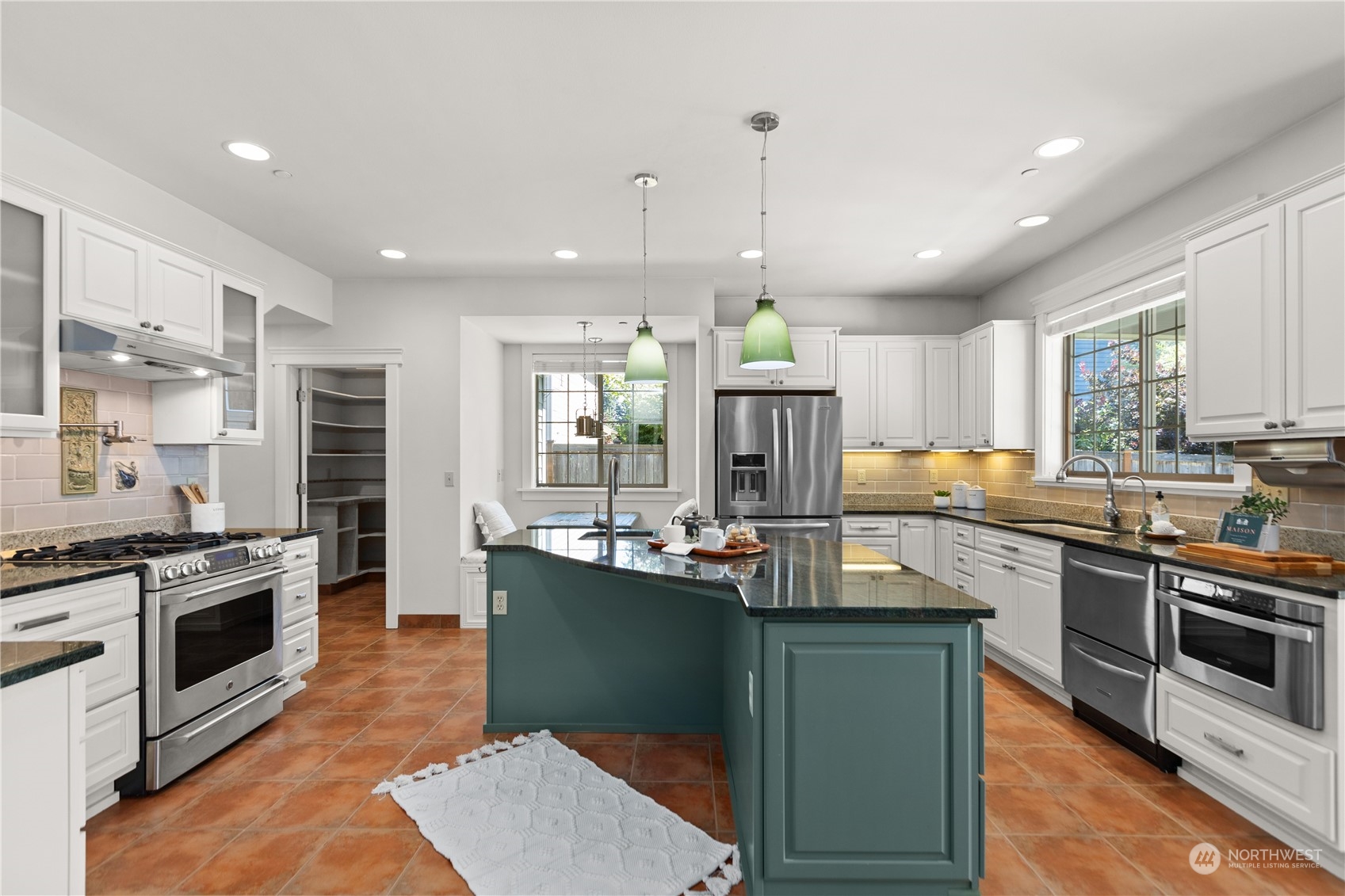 120 216th Street Southwest Bothell, WA 98021 - Photo 11 of 40 a kitchen with stainless steel appliances granite countertop a sink stove and refrigerator