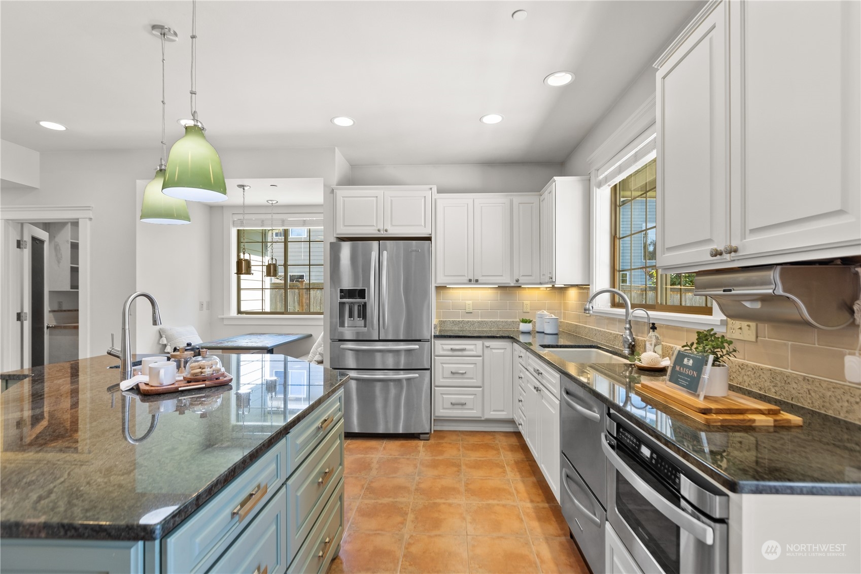 120 216th Street Southwest Bothell, WA 98021 - Photo 12 of 40 a kitchen with stainless steel appliances granite countertop a sink a stove and a refrigerator