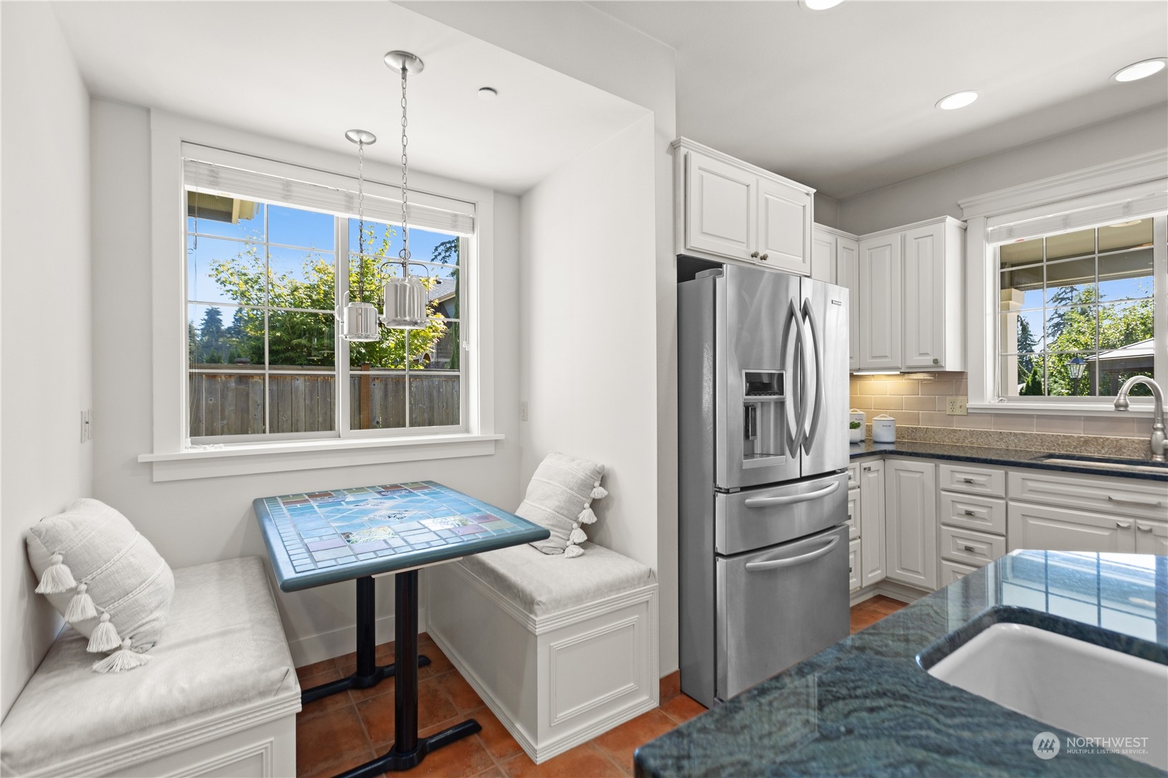 120 216th Street Southwest Bothell, WA 98021 - Photo 13 of 40 a kitchen with stainless steel appliances a refrigerator a stove a sink and white cabinets
