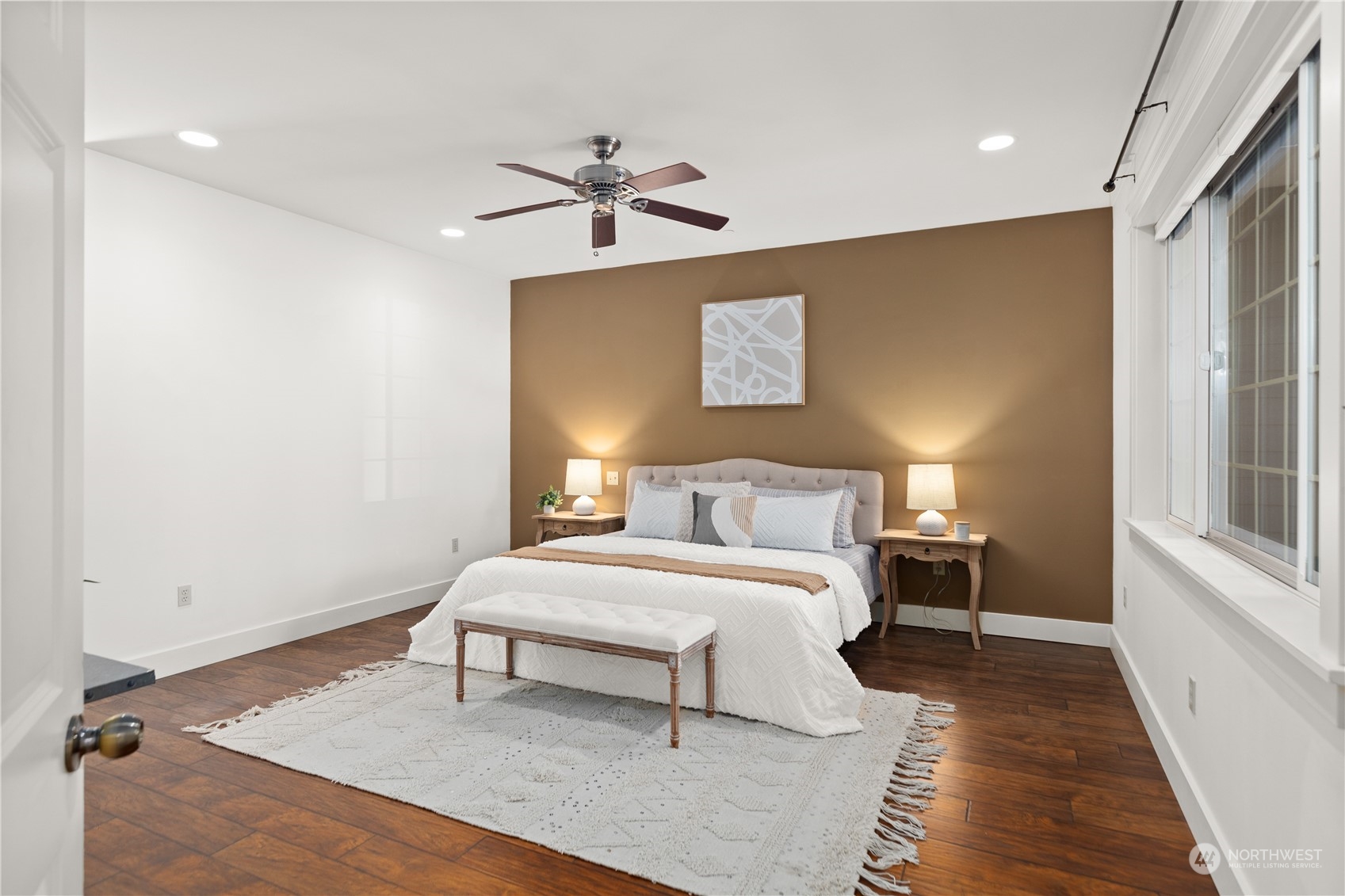 120 216th Street Southwest Bothell, WA 98021 - Photo 15 of 40 a bedroom with a bed and a chandelier