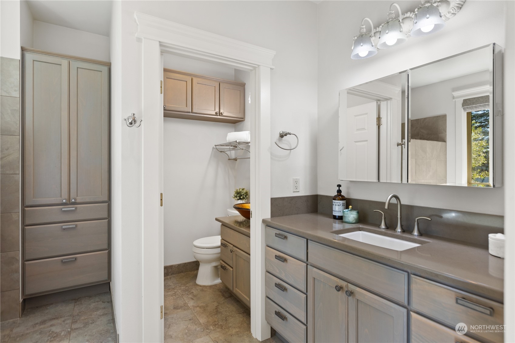 120 216th Street Southwest Bothell, WA 98021 - Photo 17 of 40 a bathroom with a double vanity sink a toilet and a mirror