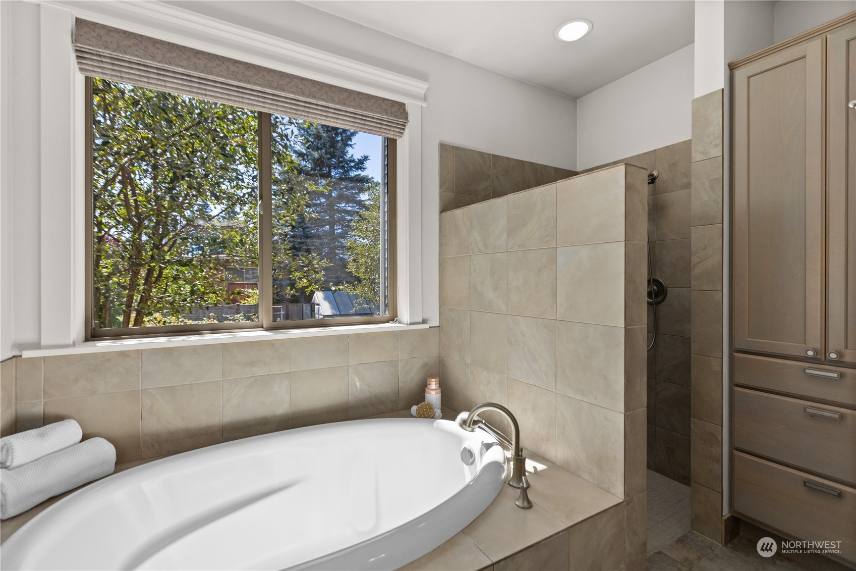 120 216th Street Southwest Bothell, WA 98021 - Photo 18 of 40 a bathroom with a tub and shower