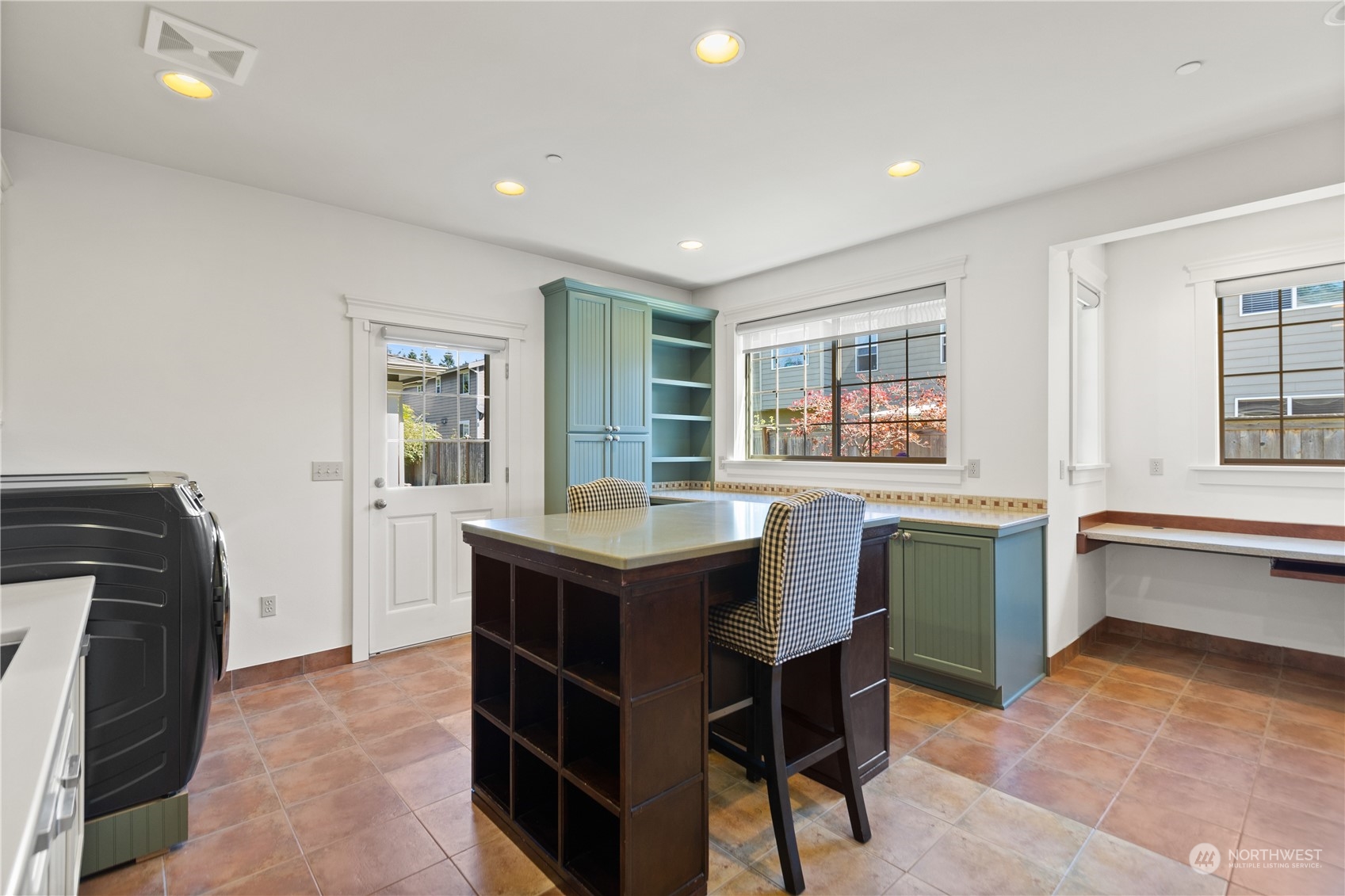 120 216th Street Southwest Bothell, WA 98021 - Photo 20 of 40 a living room with furniture and a dining table with kitchen view