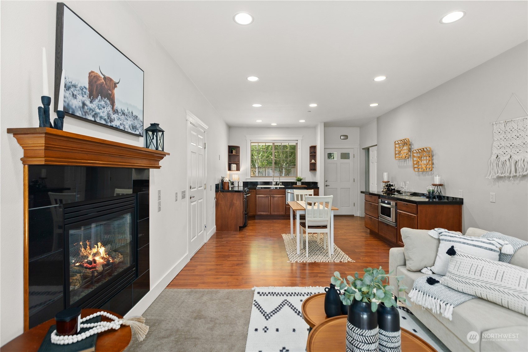 120 216th Street Southwest Bothell, WA 98021 - Photo 25 of 40 a living room with furniture a flat screen tv and a fireplace