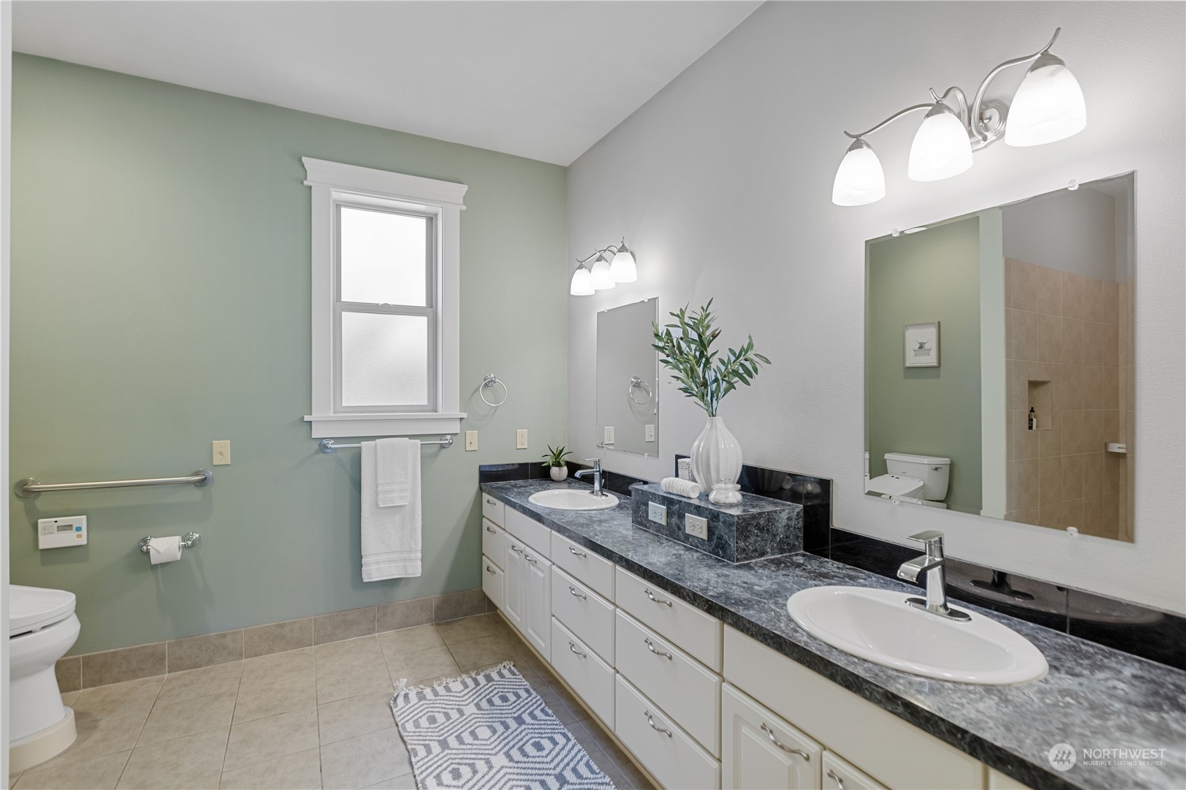 120 216th Street Southwest Bothell, WA 98021 - Photo 29 of 40 a bathroom with a granite countertop double vanity sink a mirror and a toilet