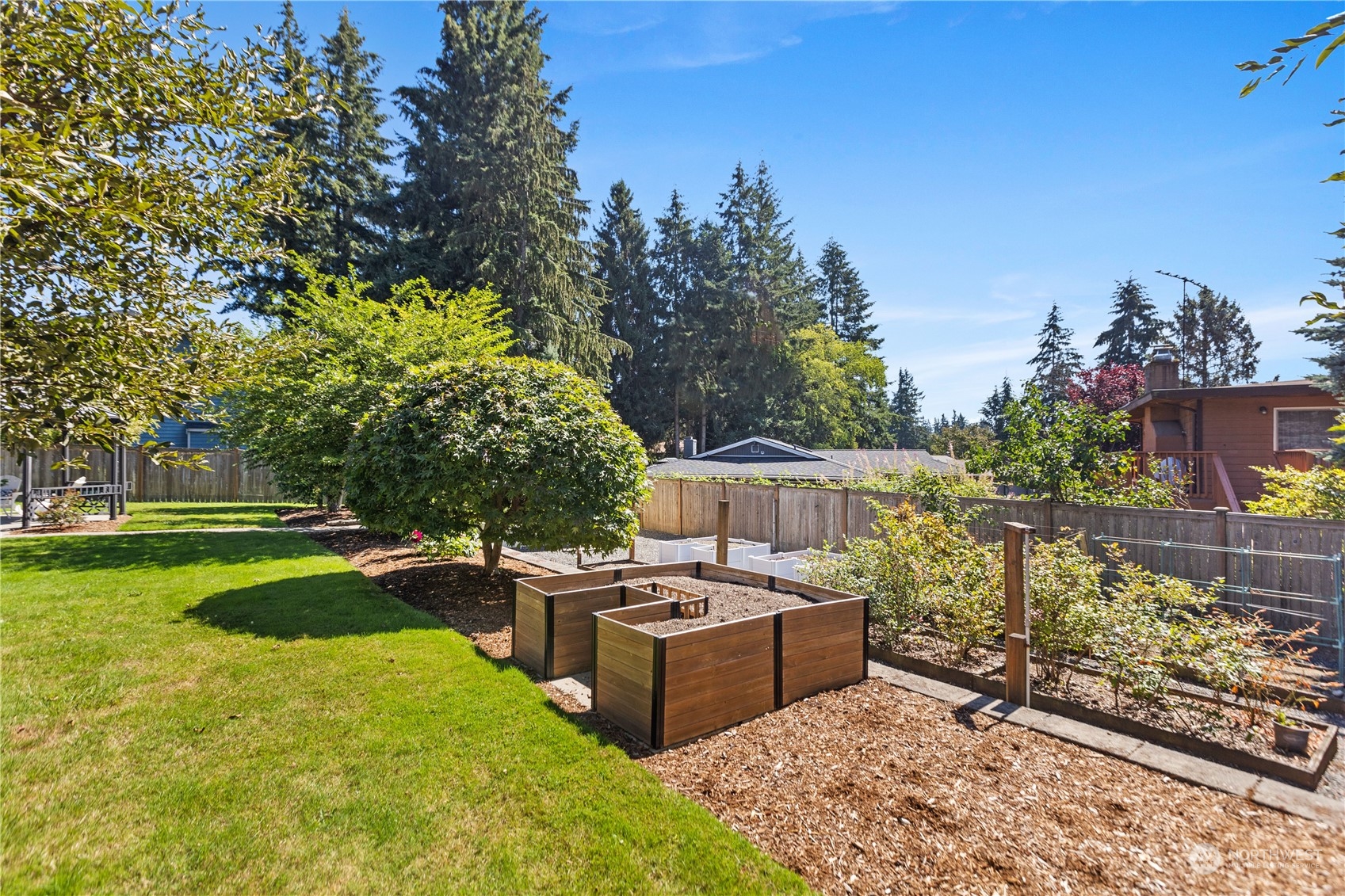120 216th Street Southwest Bothell, WA 98021 - Photo 32 of 40 a view of a swimming pool with a patio and a garden