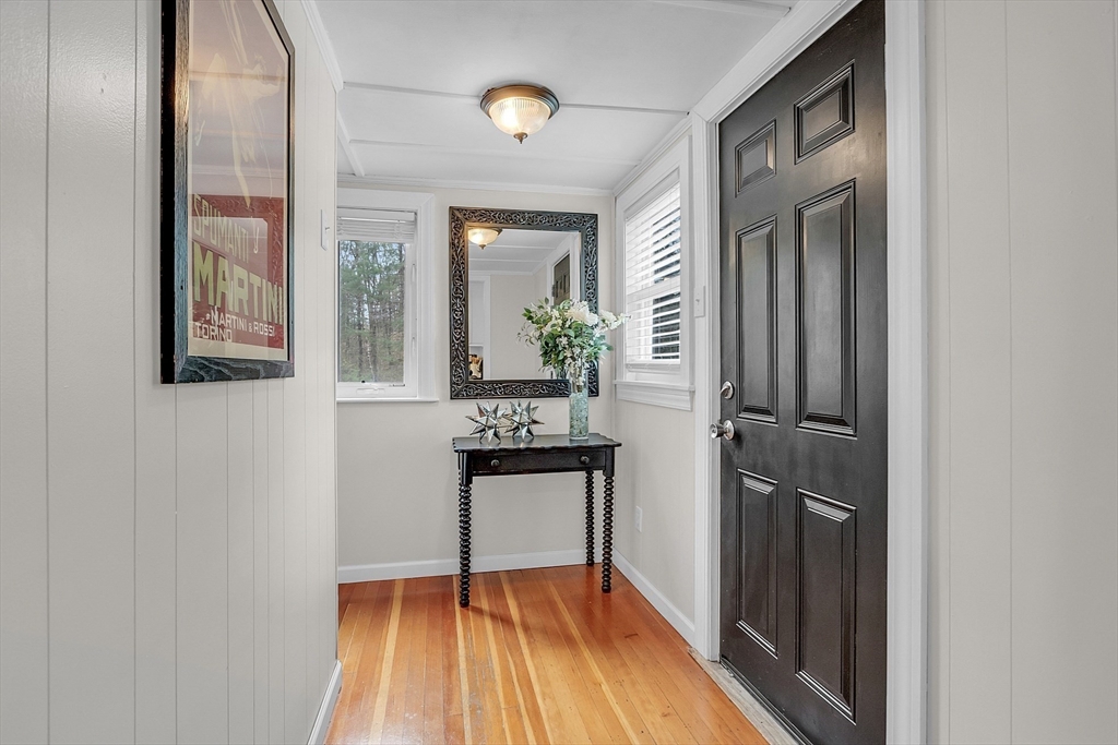 8 Mt Henry Road Shirley, MA 01464 - Photo 16 of 31 a view of a hallway with wooden floor and a bathroom