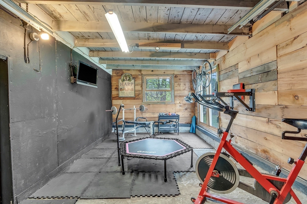 8 Mt Henry Road Shirley, MA 01464 - Photo 29 of 31 a dining room with furniture and a chandelier