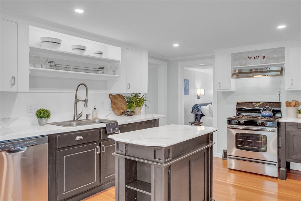 8 Mt Henry Road Shirley, MA 01464 - Photo 6 of 31 a kitchen with a sink a stove and cabinets