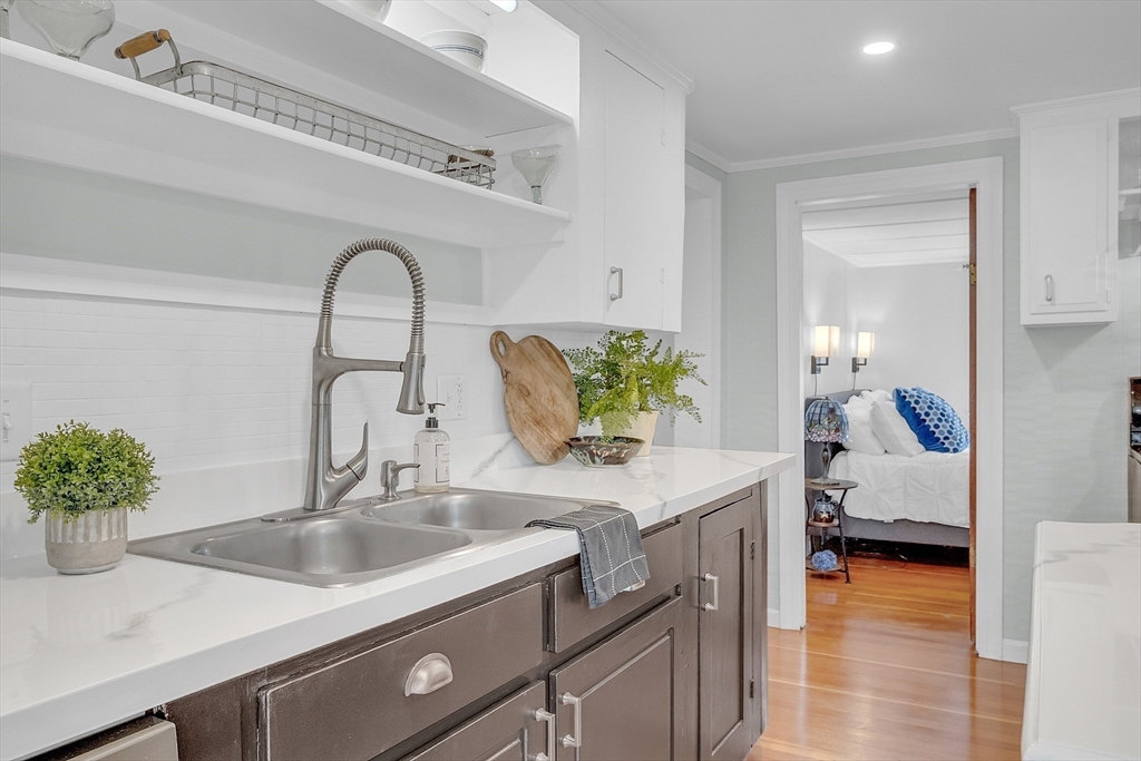 8 Mt Henry Road Shirley, MA 01464 - Photo 8 of 31 a kitchen with a sink and a wooden floor