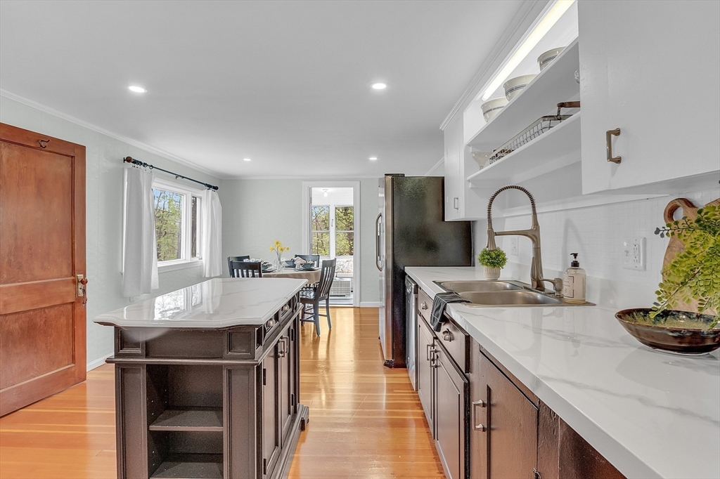 8 Mt Henry Road Shirley, MA 01464 - Photo 9 of 31 a kitchen with stainless steel appliances granite countertop a sink a stove and a refrigerator