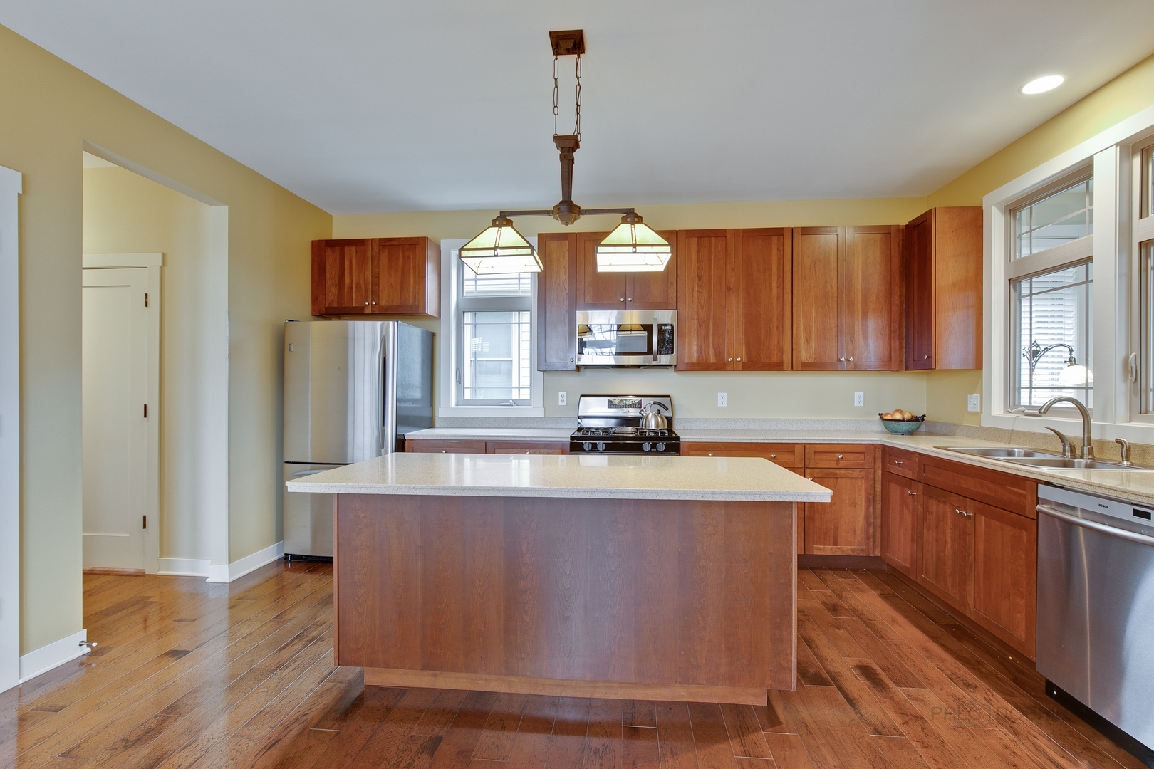 1024 Harris Road Grayslake, IL 60030 - Photo 11 of 29 a large kitchen with granite countertop a sink stainless steel appliances and cabinets
