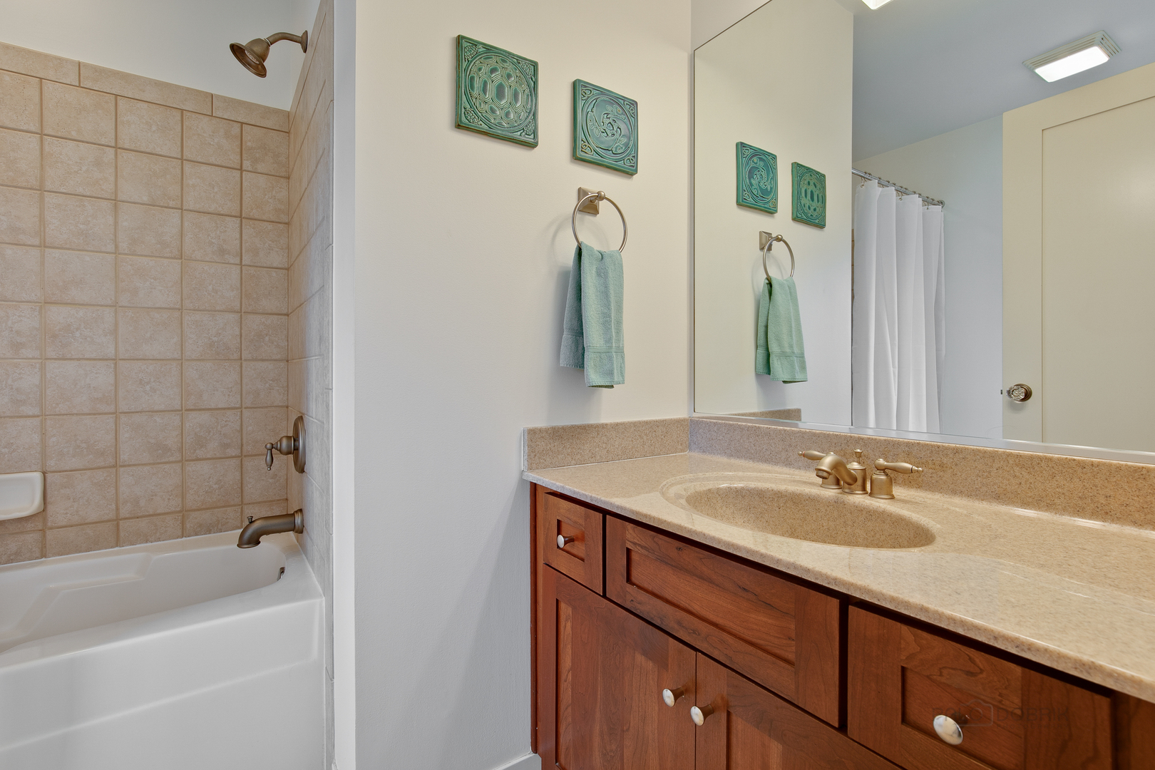 1024 Harris Road Grayslake, IL 60030 - Photo 21 of 29 a bathroom with a granite countertop sink a mirror a shower and a bathtub