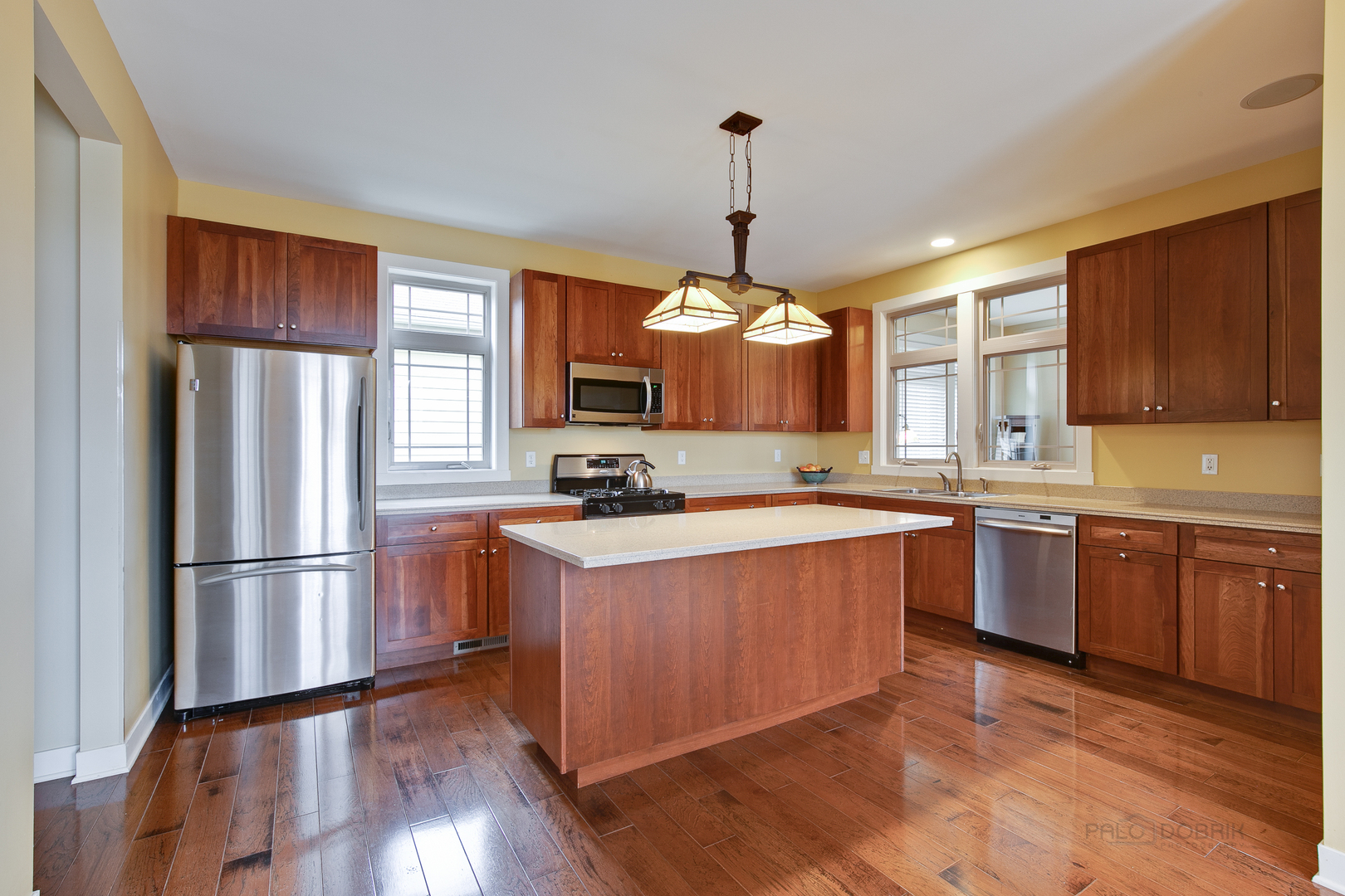 1024 Harris Road Grayslake, IL 60030 - Photo 10 of 29 a kitchen with stainless steel appliances granite countertop a refrigerator a sink dishwasher a stove and a wooden floor