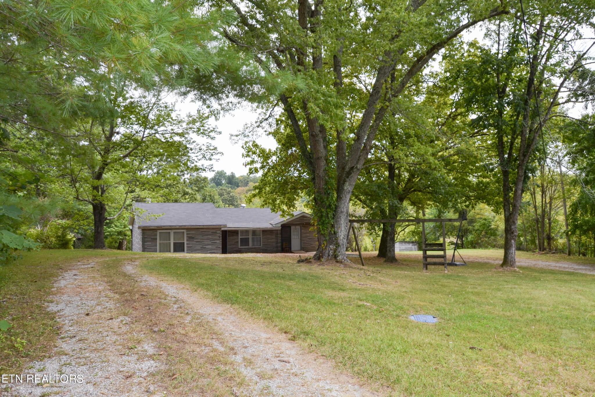 147 Tom Davis Road Livingston, TN 38570 - Photo 3 of 29 a view of house with outdoor space and tree s