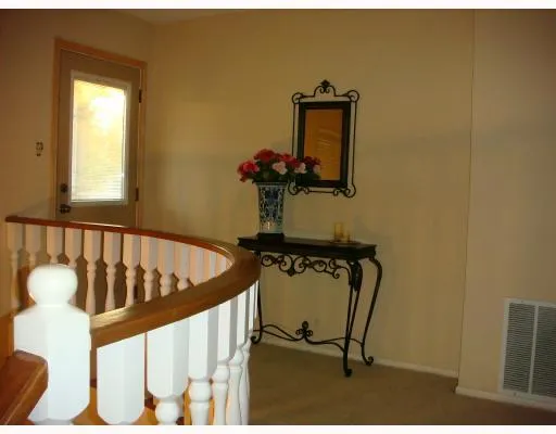 a view of staircase with wooden floor