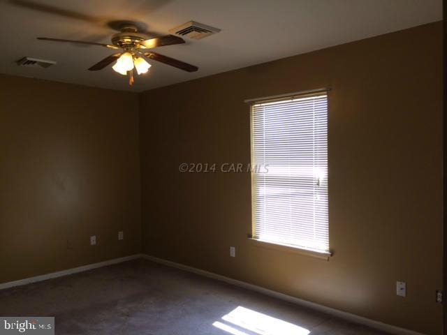 27063 Walnut Tree Road Eden, MD 21822 - Photo 13 of 22 a view of a livingroom with a ceiling fan and window