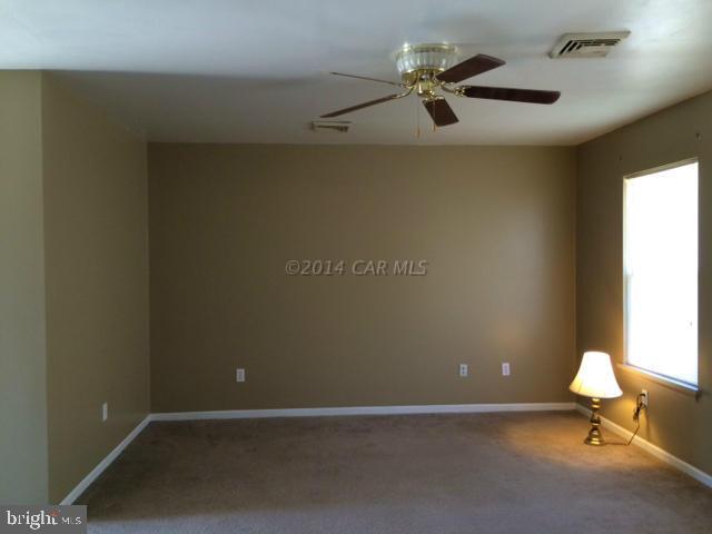 27063 Walnut Tree Road Eden, MD 21822 - Photo 4 of 22 an empty room with a window