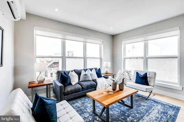 a living room with furniture and a window
