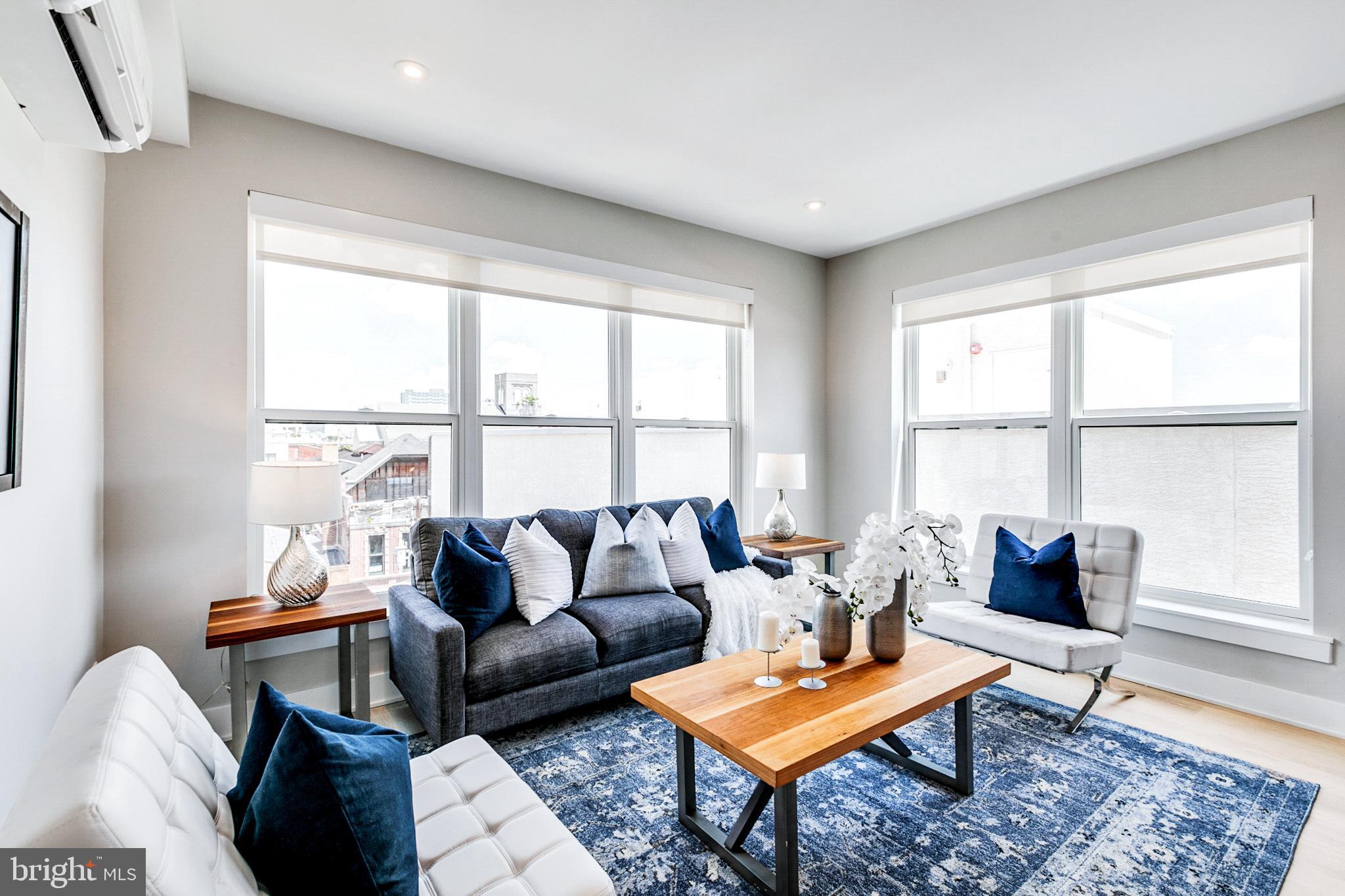 a living room with furniture and a window