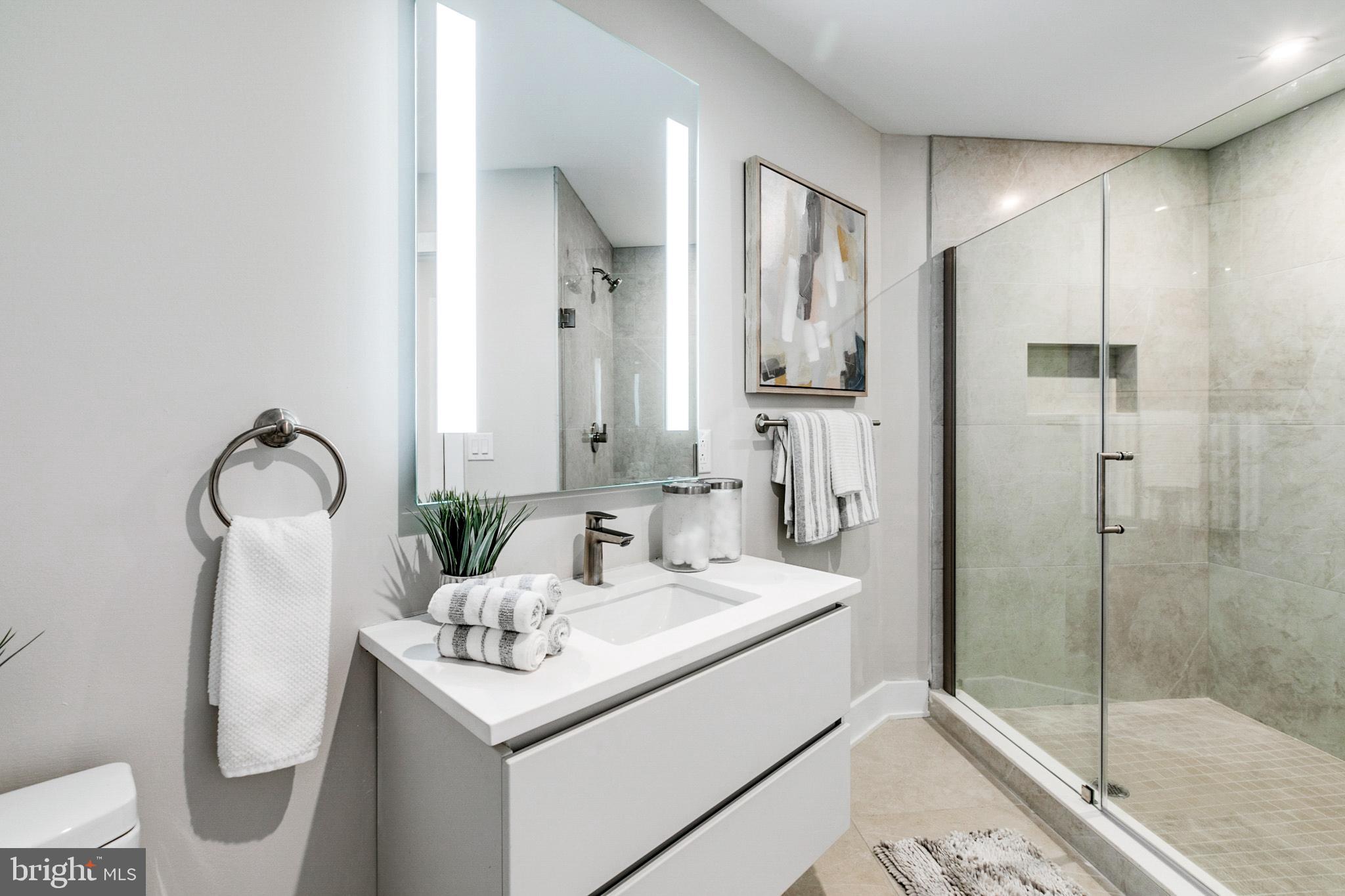 1533 Ridge Avenue, Unit 506 Philadelphia, PA 19130 - Photo 5 of 20 a bathroom with a sink toilet and shower