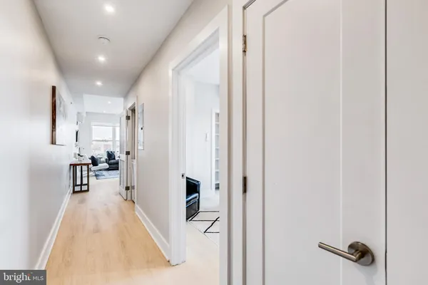 a view of a living room with a wooden floor