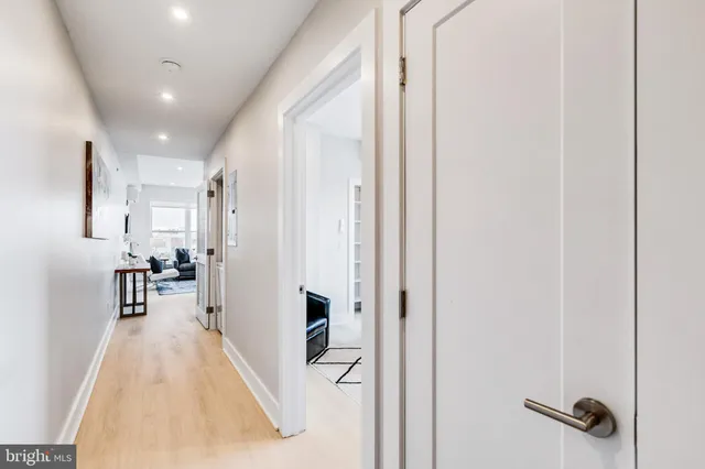 a view of a living room with a wooden floor