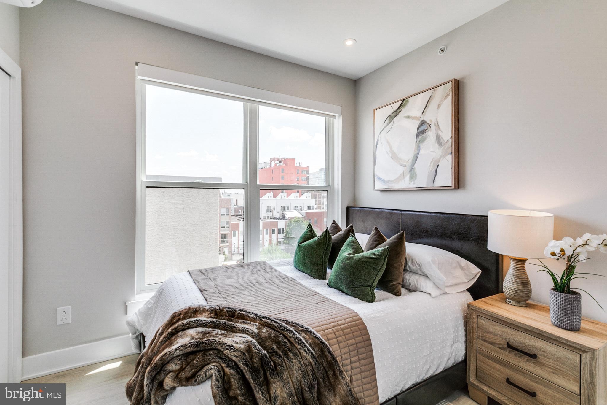 1533 Ridge Avenue, Unit 506 Philadelphia, PA 19130 - Photo 10 of 20 a bedroom with bed and a window