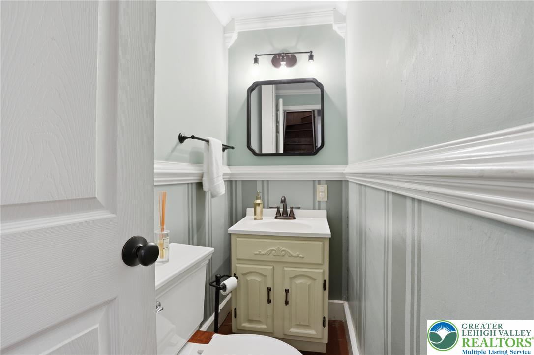 2014 Linden Street Bethlehem, PA 18017 - Photo 19 of 85 A compact powder room with wainscoting and crown molding offers charming detail.