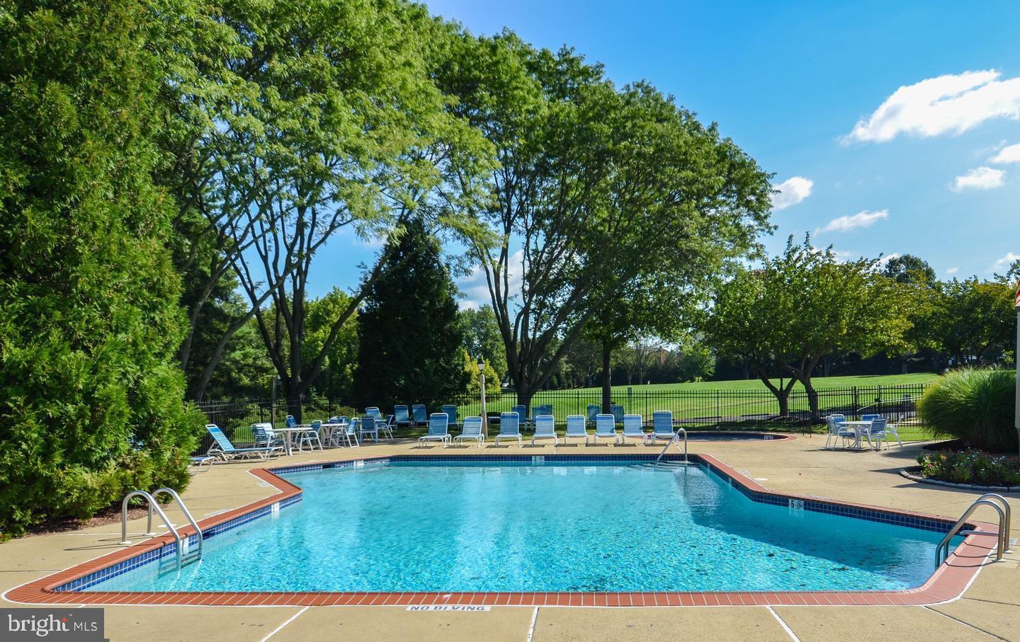 202 Hackberry Court Warrington, PA 18976 - Photo 3 of 7 a view of a swimming pool with a patio