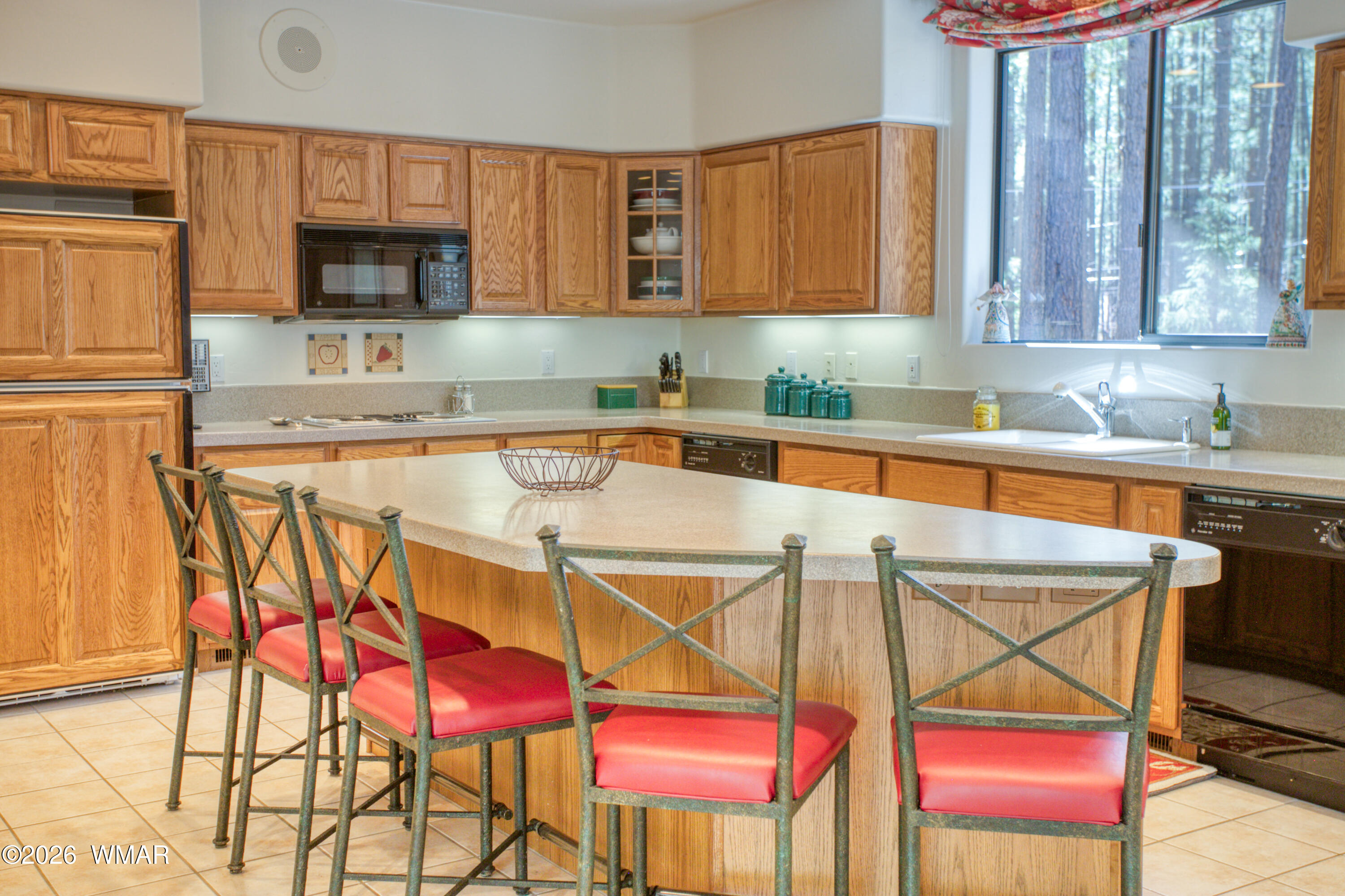 2896 Aspen Road Pinetop, AZ 85935 - Photo 15 of 75 a kitchen with stainless steel appliances granite countertop a sink and a white cabinets