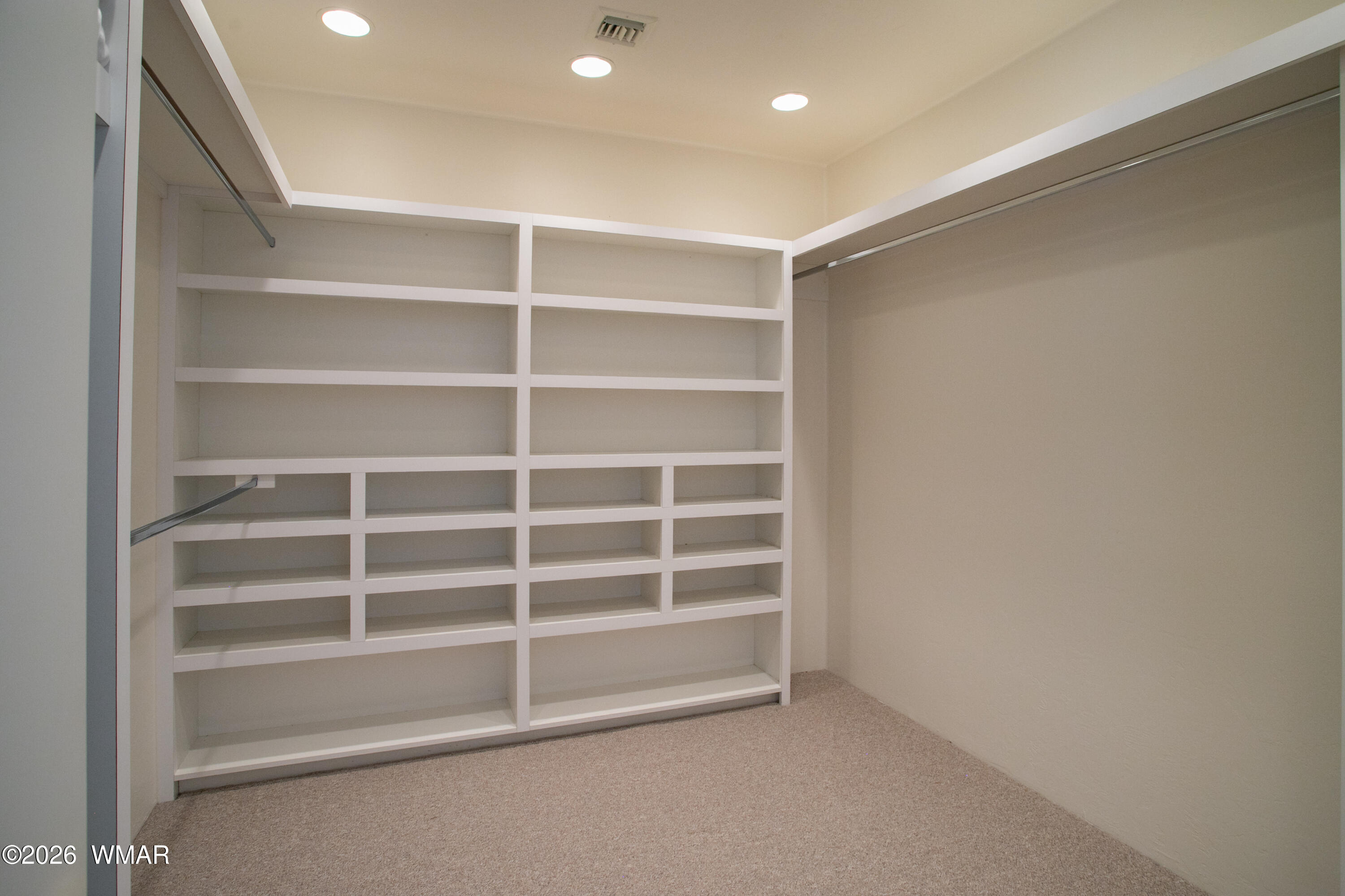 2896 Aspen Road Pinetop, AZ 85935 - Photo 26 of 75 a view of an empty room with empty shelves