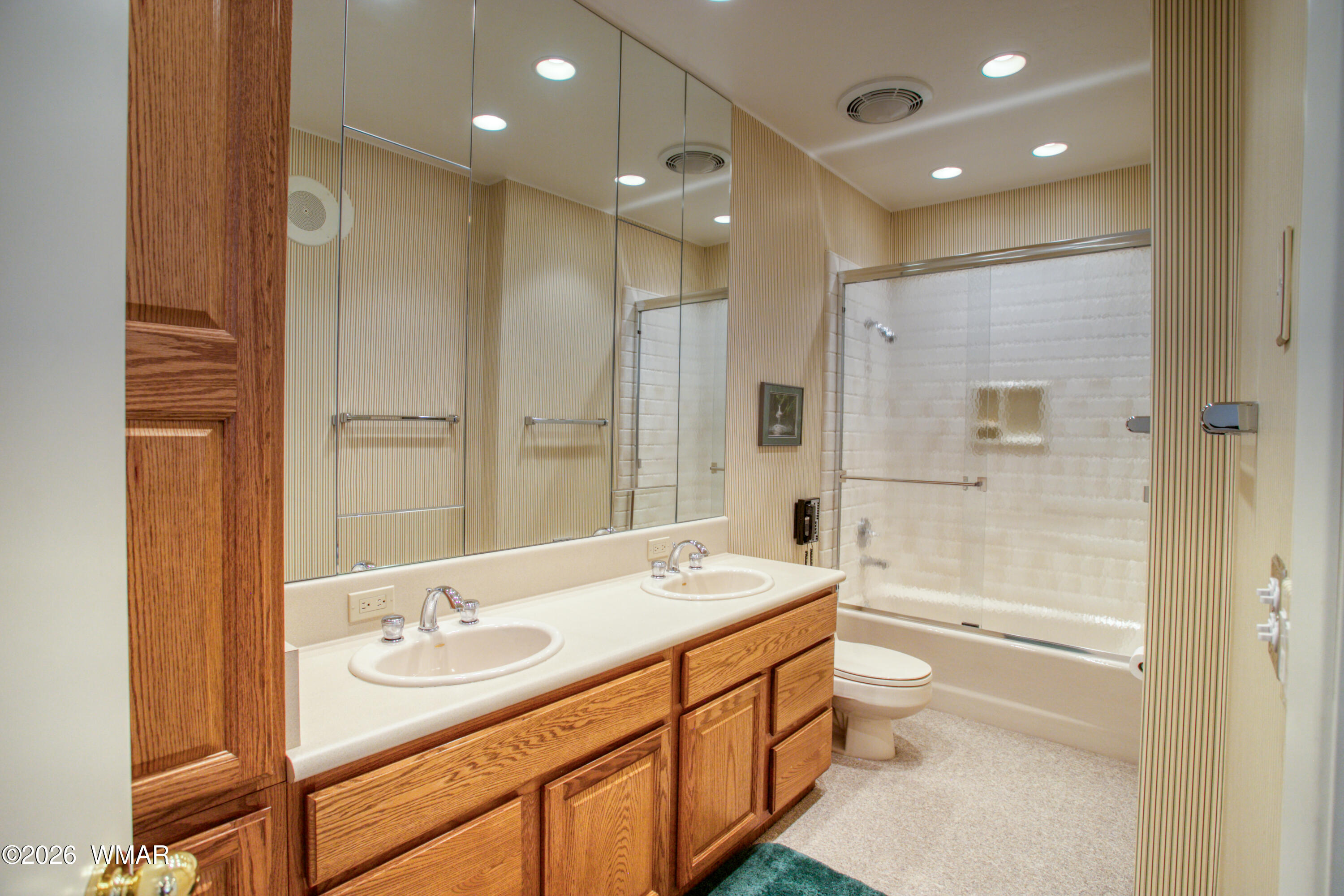 2896 Aspen Road Pinetop, AZ 85935 - Photo 42 of 75 a bathroom with a double vanity sink mirror double shower and a bathtub