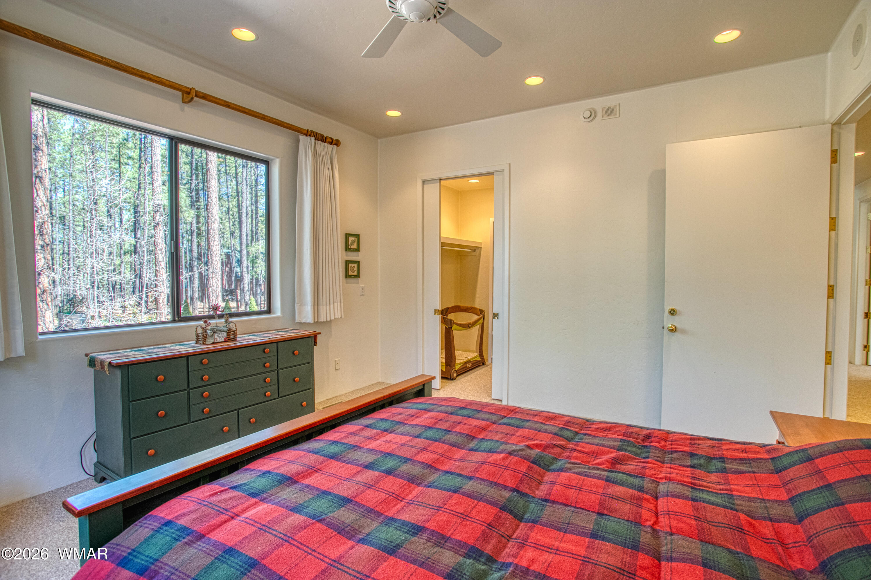 2896 Aspen Road Pinetop, AZ 85935 - Photo 43 of 75 a bedroom with a bed and a window