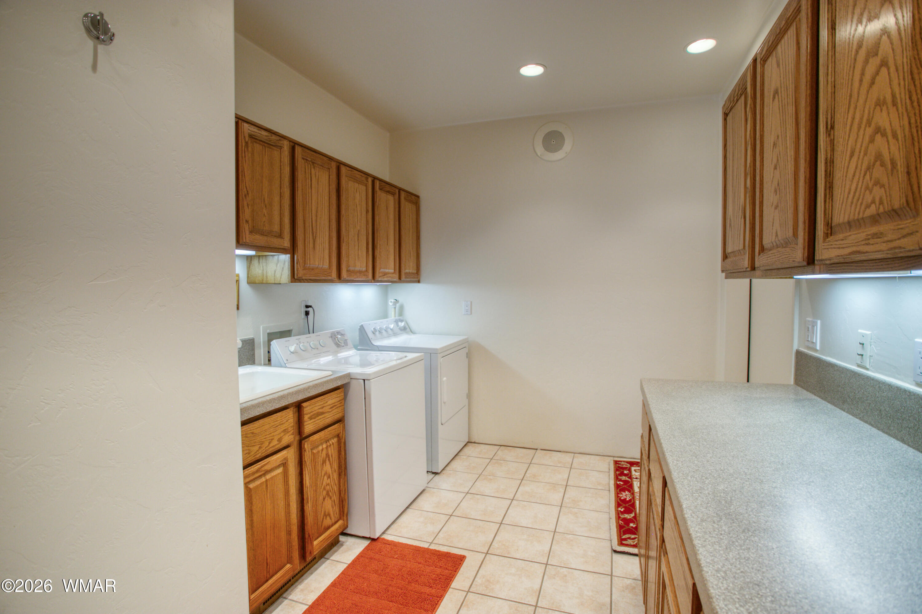 2896 Aspen Road Pinetop, AZ 85935 - Photo 53 of 75 a kitchen with a sink a stove cabinets and a wooden floor
