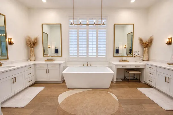 a bathroom with a tub sink and mirror