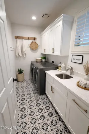 a kitchen with a sink a stove a refrigerator and cabinets