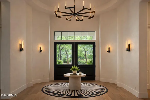 a dining room with a table and a potted plant