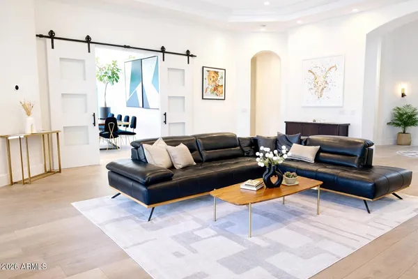 a living room with furniture and a table