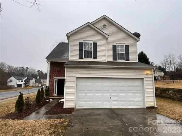 a front view of a house with a garage