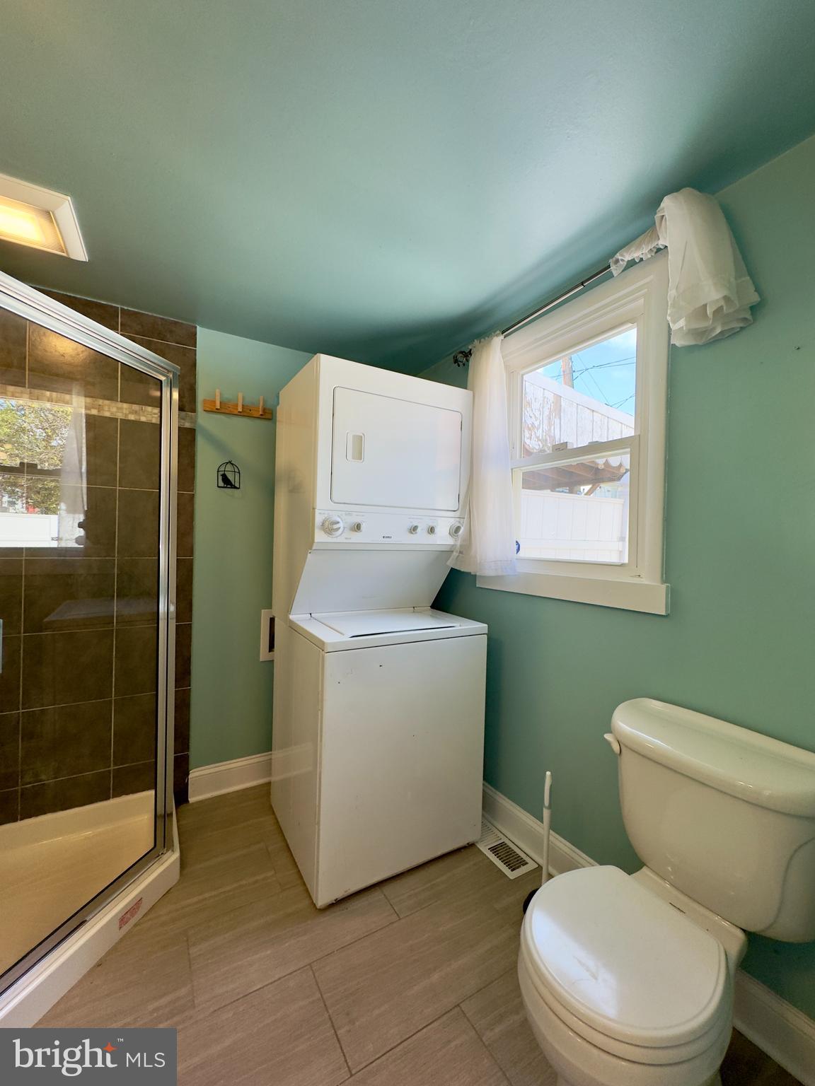 3314 Keswick Road Baltimore, MD 21211 - Photo 11 of 20 a white toilet sitting next to a bathroom sink