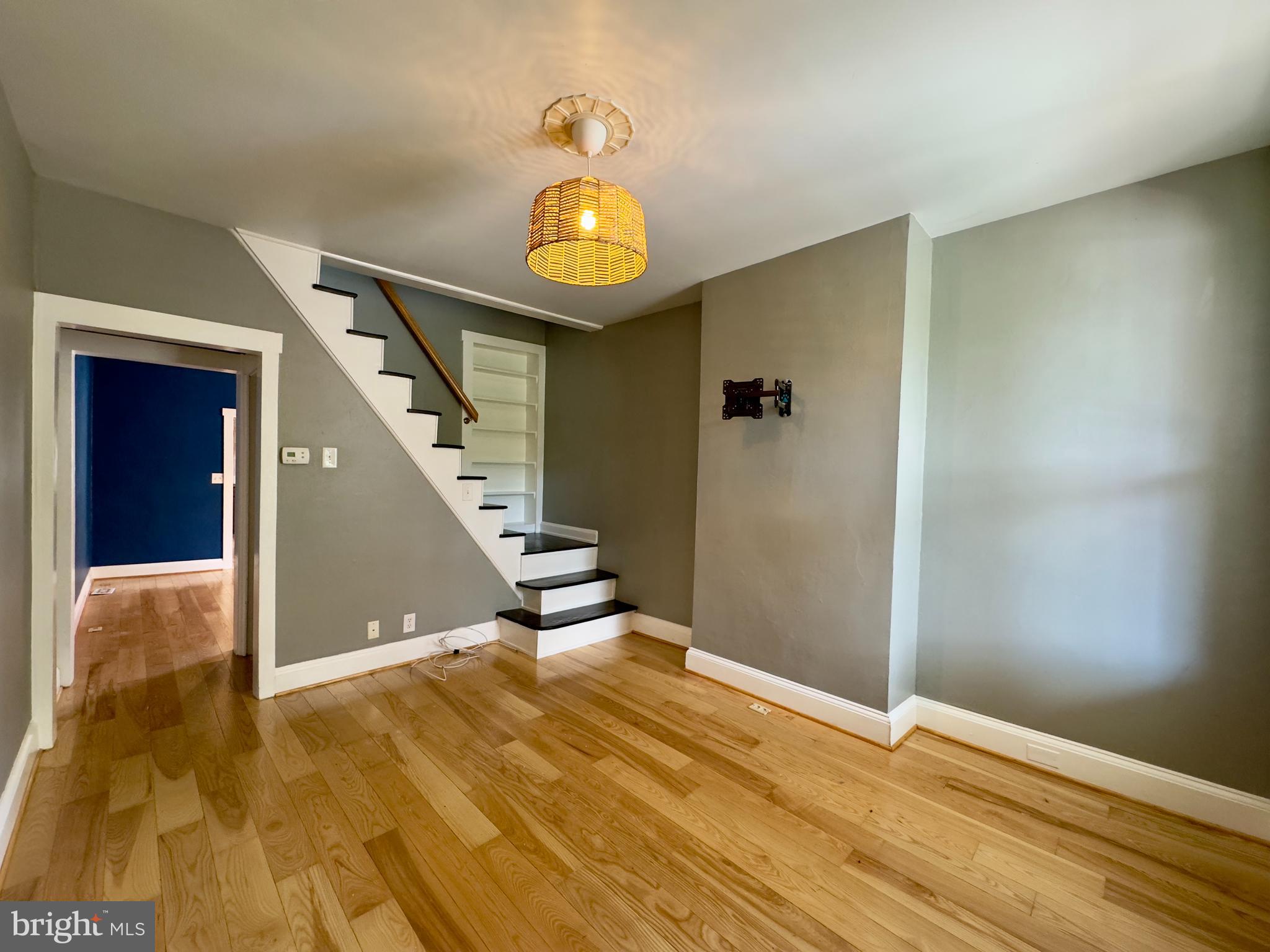3314 Keswick Road Baltimore, MD 21211 - Photo 3 of 20 a view of an empty room with wooden floor