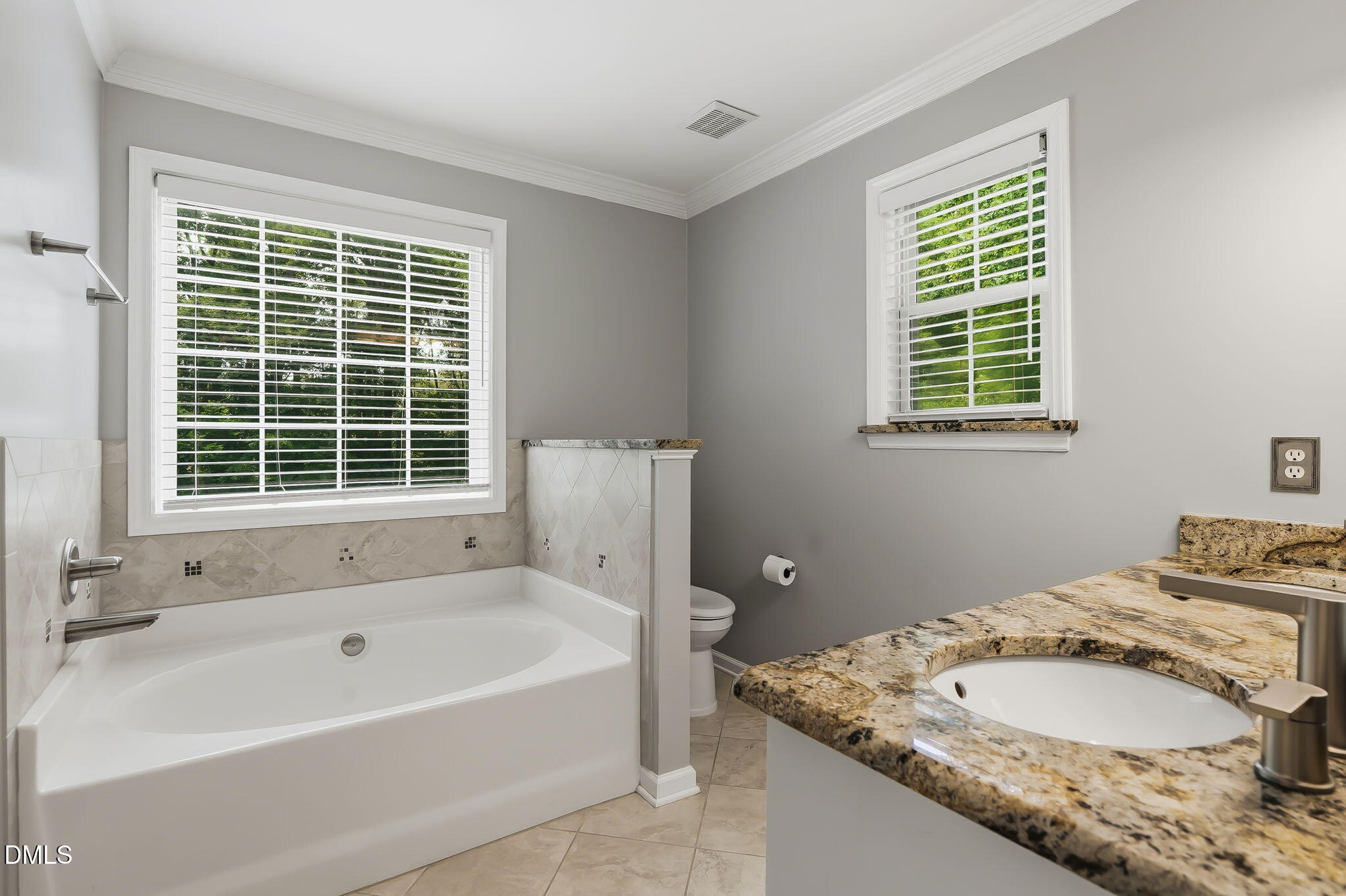 1112 Tyler Farms Drive Raleigh, NC 27603 - Photo 35 of 78 a bathroom with a granite countertop tub and a sink