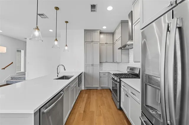 a view of kitchen with cabinets and wooden floor