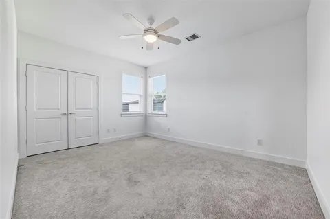 a bathroom view of a toilet and a shower